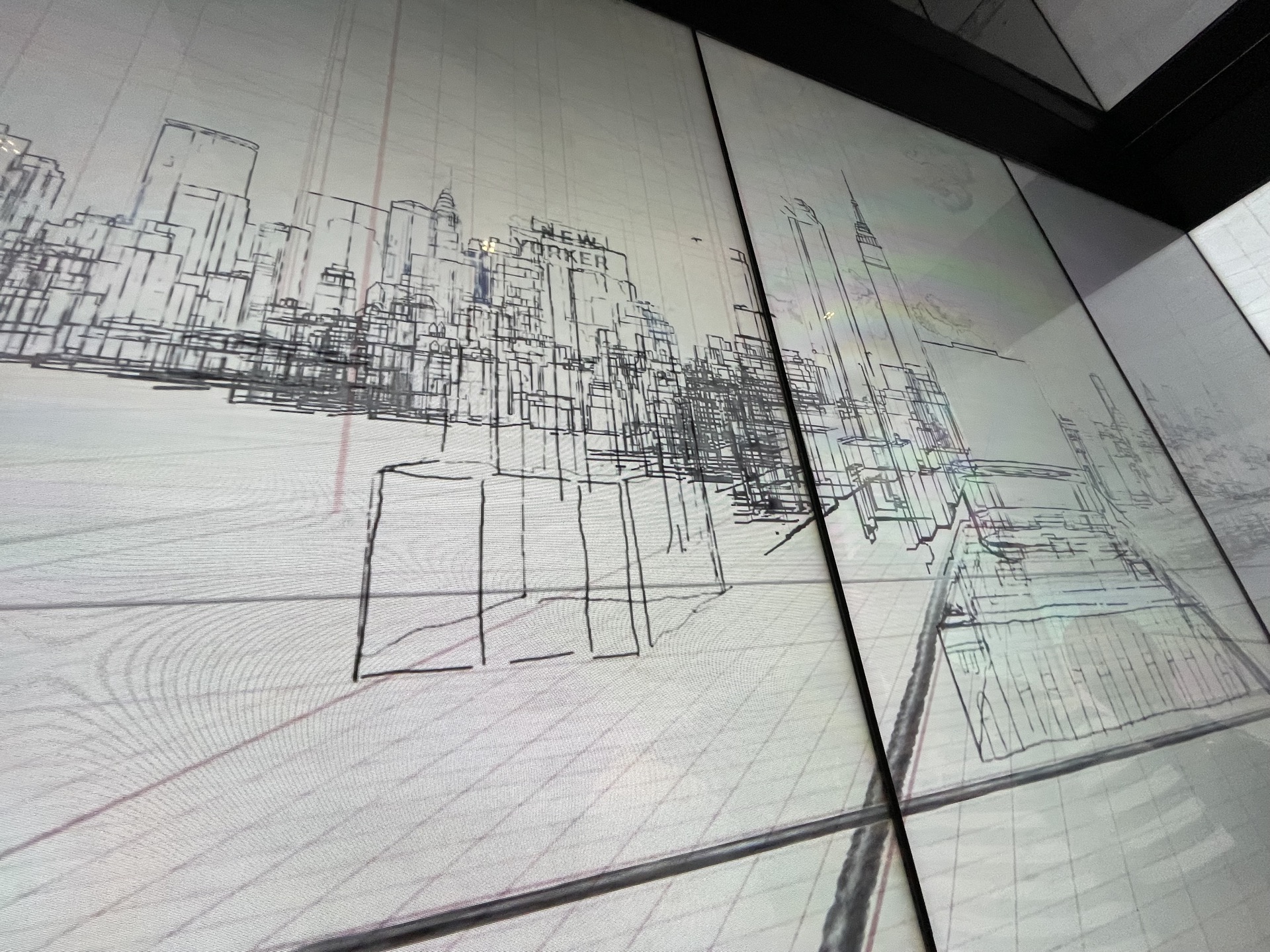 A screen with a drawing of a city